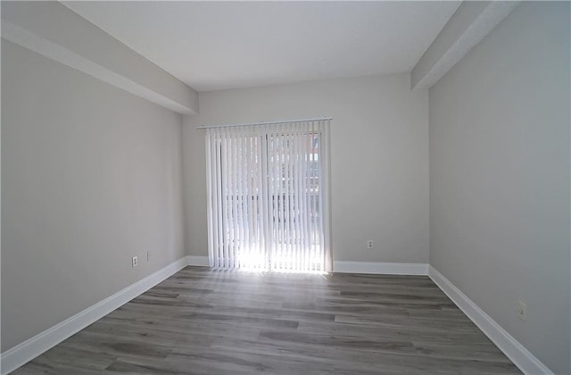 1074 Peachtree Walk NE Unit B 216, Atlanta, GA 30309 - empty room featuring baseboards and wood finished floors