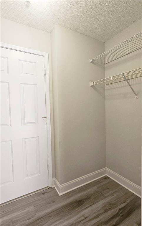 1074 Peachtree Walk NE Unit B 216, Atlanta, GA 30309 - walk in closet featuring dark wood-type flooring