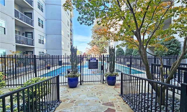 1074 Peachtree Walk NE Unit B 216, Atlanta, GA 30309 - view of patio / terrace featuring a community pool and fence