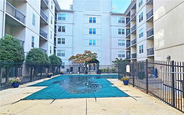 1074 Peachtree Walk NE Unit B 216, Atlanta, GA 30309 - pool with a patio and fence