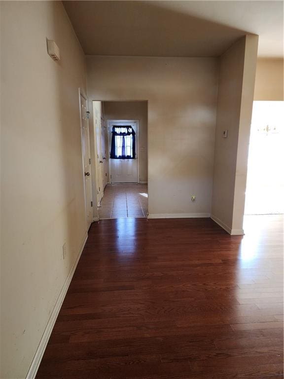 hall with dark hardwood / wood-style floors