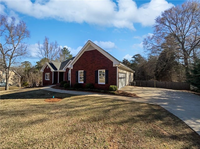 view of front of house featuring driveway, a garage, fence, a front lawn, and brick siding