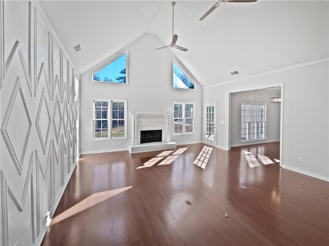 unfurnished living room featuring a fireplace with raised hearth, high vaulted ceiling, ceiling fan, wood finished floors, and visible vents