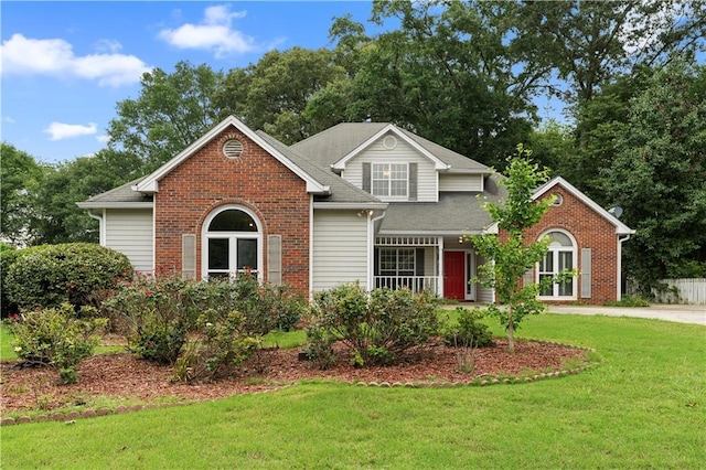 2881 Bridle Creek Dr SW, Conyers, GA 30094 - traditional-style home featuring a front lawn, brick siding, and a shingled roof