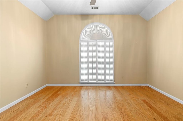 2881 Bridle Creek Dr SW, Conyers, GA 30094 - spare room with vaulted ceiling, baseboards, and wood finished floors