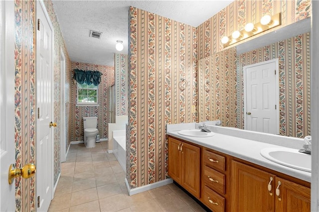 2881 Bridle Creek Dr SW, Conyers, GA 30094 - bathroom with tile patterned flooring, double vanity, a garden tub, wallpapered walls, and toilet