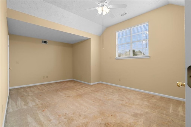 2881 Bridle Creek Dr SW, Conyers, GA 30094 - carpeted empty room with lofted ceiling, a ceiling fan, baseboards, and a textured ceiling