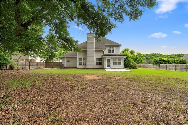2881 Bridle Creek Dr SW, Conyers, GA 30094 - back of property with a patio and a chimney