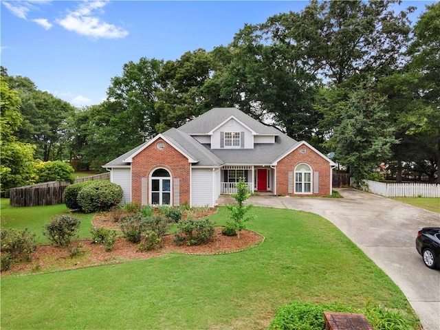 2881 Bridle Creek Dr SW, Conyers, GA 30094 - traditional-style house with brick siding, driveway, and covered porch