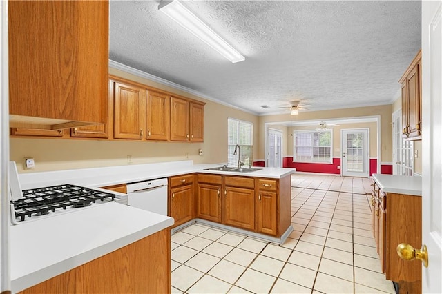 2881 Bridle Creek Dr SW, Conyers, GA 30094 - kitchen with a sink, white appliances, a peninsula, a ceiling fan, and light tile patterned flooring