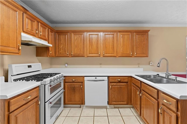 2881 Bridle Creek Dr SW, Conyers, GA 30094 - kitchen with white appliances, under cabinet range hood, a sink, brown cabinets, and crown molding