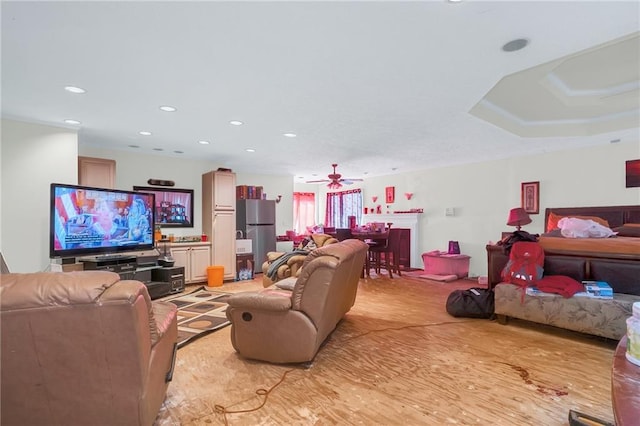 living area with recessed lighting and ceiling fan