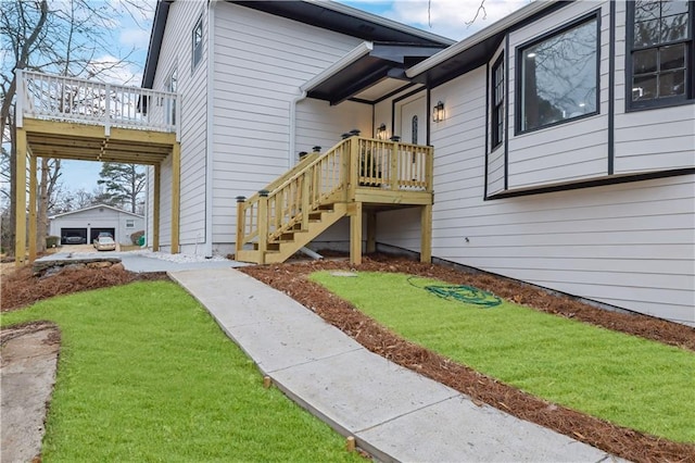 doorway to property with a yard