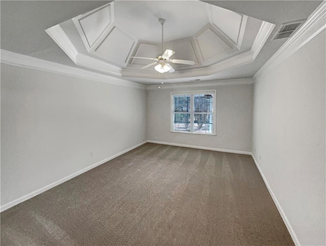 carpeted spare room with ceiling fan, coffered ceiling, and ornamental molding