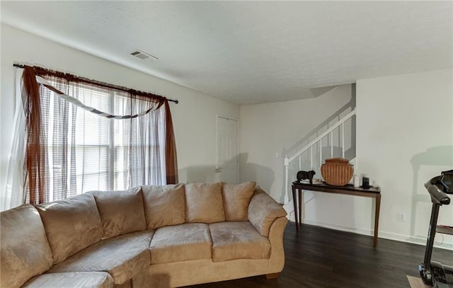 living room with dark hardwood / wood-style flooring