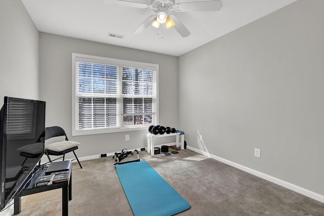 workout room featuring carpet, ceiling fan, and baseboards