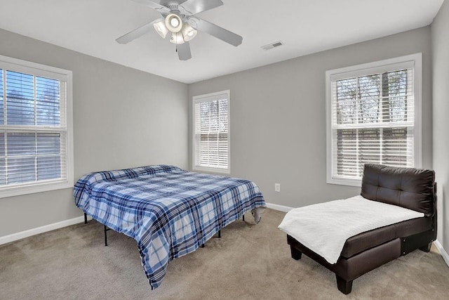 bedroom with baseboards, carpet flooring, and ceiling fan