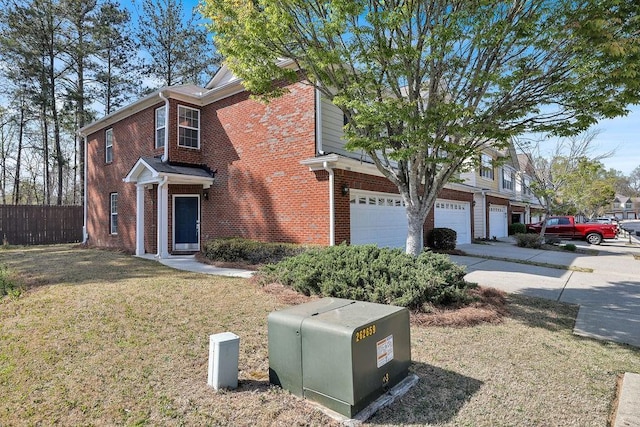 traditional-style house with brick siding and a garage