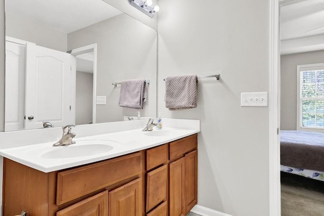 ensuite bathroom featuring double vanity