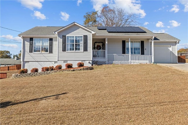 ranch-style house featuring a front lawn, roof mounted solar panels, covered porch, concrete driveway, and crawl space