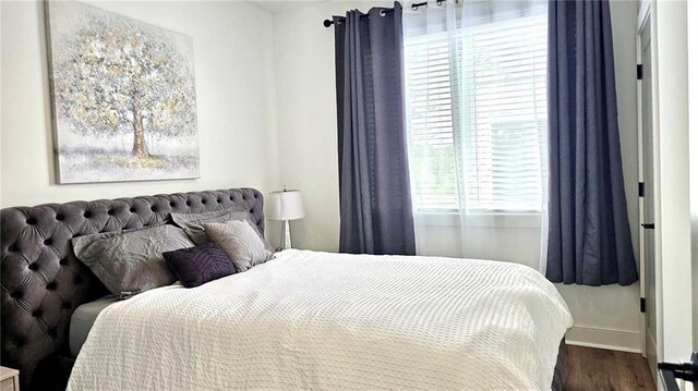 bedroom featuring wood-type flooring