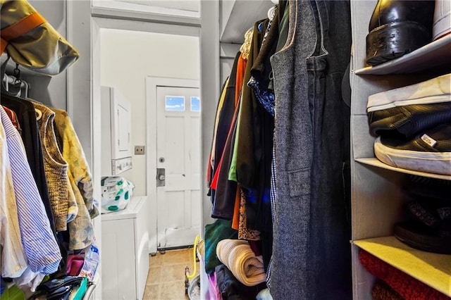 walk in closet with tile patterned floors