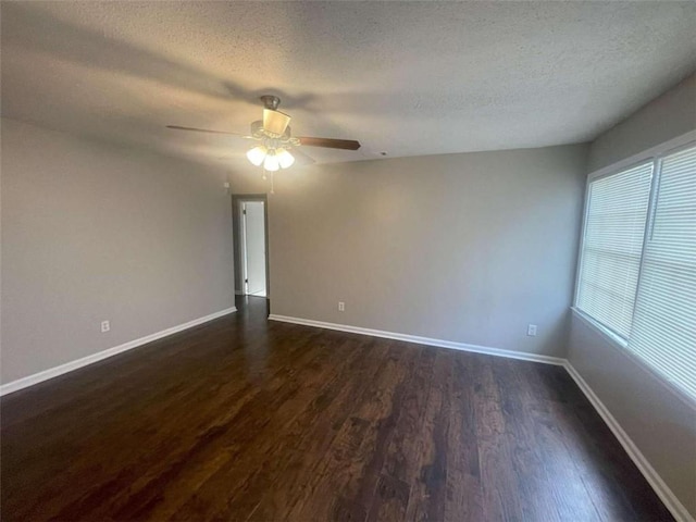 spare room featuring a textured ceiling, dark hardwood / wood-style flooring, and ceiling fan