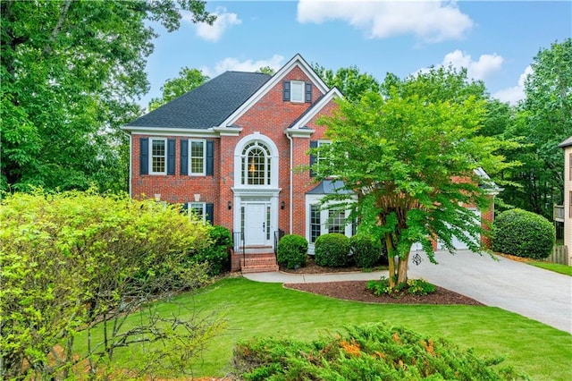 4910 Aldbury Ln, Suwanee, GA 30024 - view of front of house featuring brick siding and a front yard