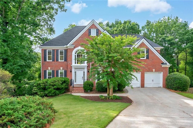 4910 Aldbury Ln, Suwanee, GA 30024 - view of front of house featuring driveway, brick siding, an attached garage, and a front lawn