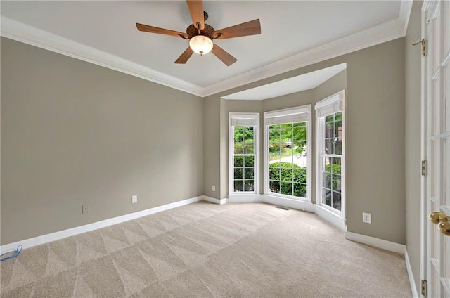 4910 Aldbury Ln, Suwanee, GA 30024 - spare room featuring light carpet, baseboards, ceiling fan, and ornamental molding