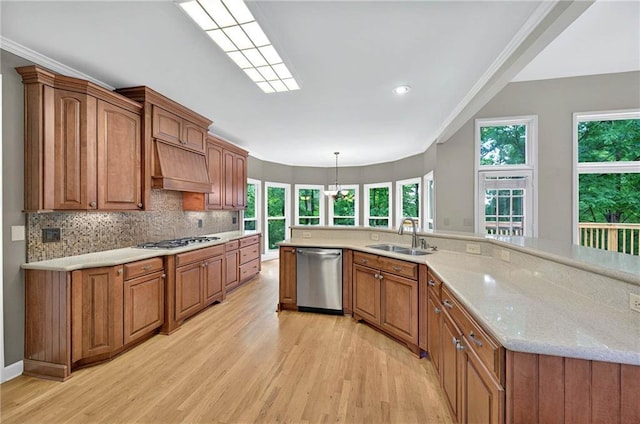4910 Aldbury Ln, Suwanee, GA 30024 - kitchen with stainless steel dishwasher, a sink, premium range hood, light wood-style floors, and recessed lighting