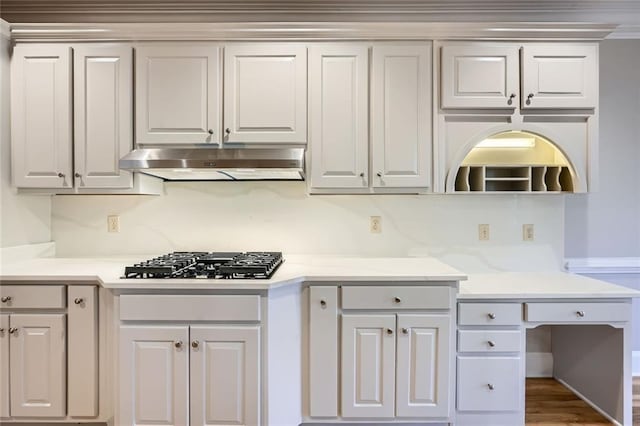 kitchen featuring white cabinetry, dark hardwood / wood-style floors, light stone countertops, and stainless steel gas cooktop