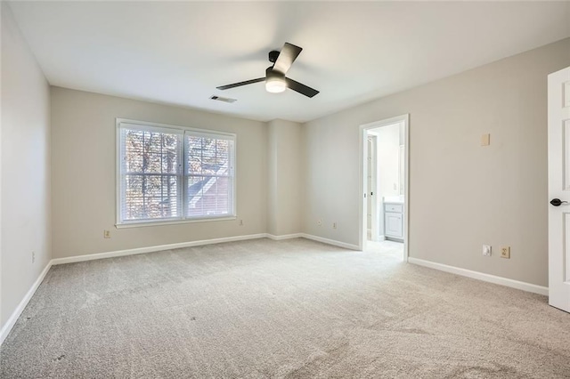 carpeted empty room featuring ceiling fan