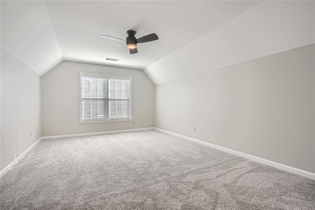 bonus room with ceiling fan, carpet floors, and vaulted ceiling