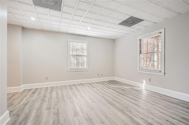 spare room with light hardwood / wood-style floors