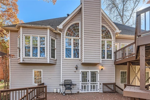 back of property with a wooden deck