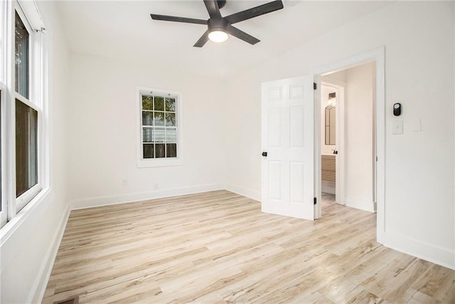 spare room with light hardwood / wood-style flooring and ceiling fan