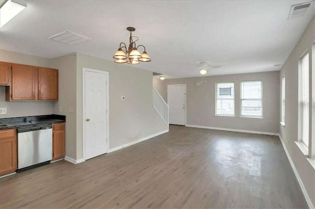 kitchen featuring decorative light fixtures, hardwood / wood-style floors, dishwasher, and ceiling fan with notable chandelier