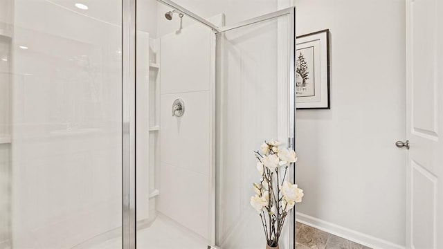 12086 Conrad Cir, Hampton, GA 30228 - bathroom with baseboards and a stall shower