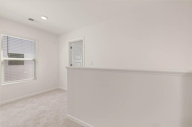 12086 Conrad Cir, Hampton, GA 30228 - spare room featuring baseboards and light colored carpet