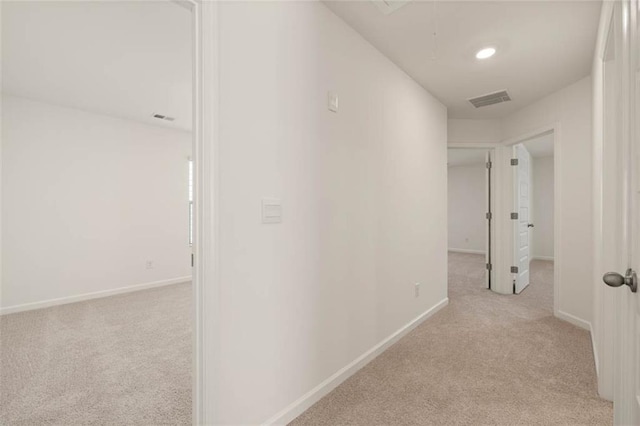 12086 Conrad Cir, Hampton, GA 30228 - hallway featuring carpet floors, baseboards, and attic access