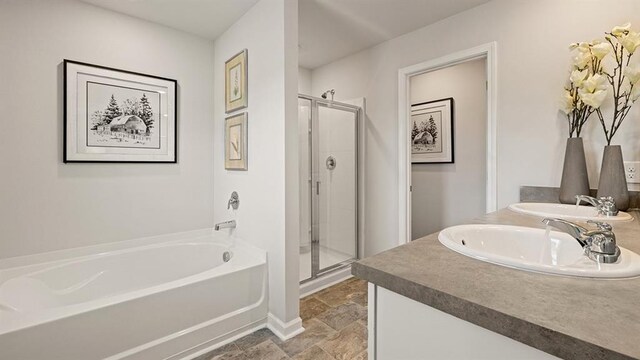 12086 Conrad Cir, Hampton, GA 30228 - full bathroom featuring a bath, a shower stall, double vanity, stone finish flooring, and baseboards