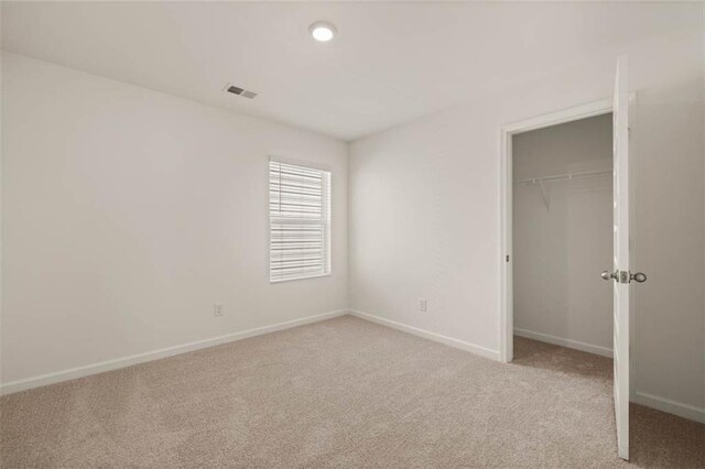 12086 Conrad Cir, Hampton, GA 30228 - unfurnished bedroom with carpet, a closet, and baseboards