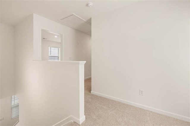 12086 Conrad Cir, Hampton, GA 30228 - corridor with baseboards, an upstairs landing, carpet floors, and attic access