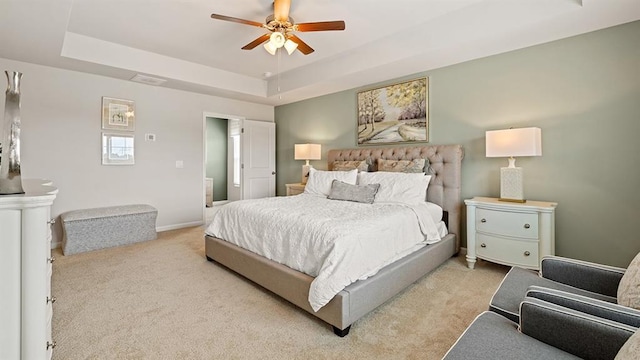 12086 Conrad Cir, Hampton, GA 30228 - carpeted bedroom featuring a tray ceiling, ceiling fan, and baseboards