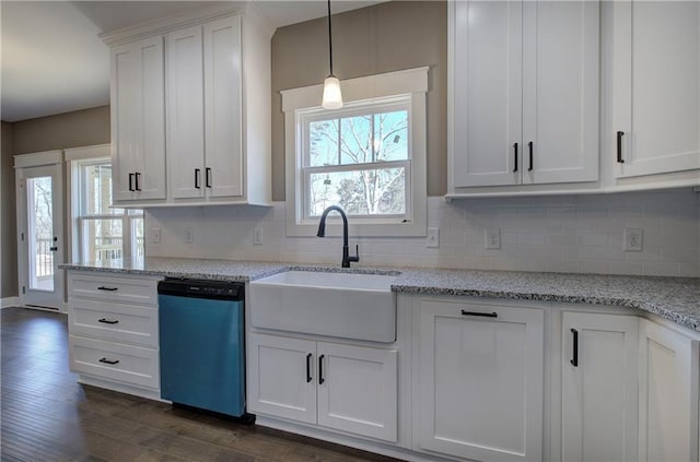 kitchen featuring white cabinetry, dishwasher, and a sink