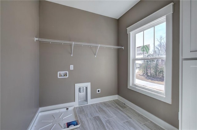 washroom with laundry area, washer hookup, a wealth of natural light, and hookup for an electric dryer