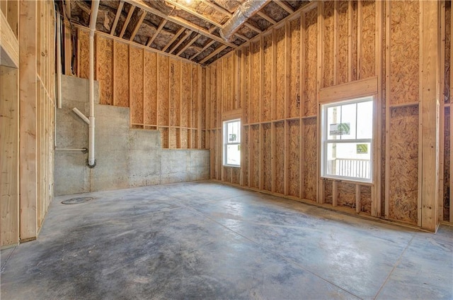 miscellaneous room featuring unfinished concrete flooring