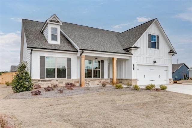 view of front of property with a garage and a porch