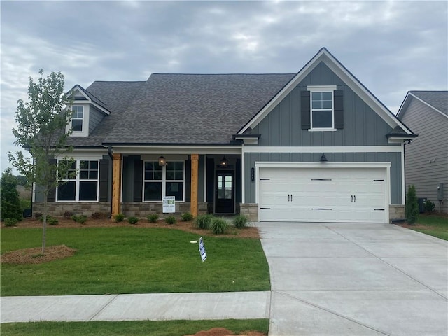 226 Montview Dr, Jefferson, GA 30549 - craftsman inspired home featuring a shingled roof, stone siding, a front lawn, and board and batten siding